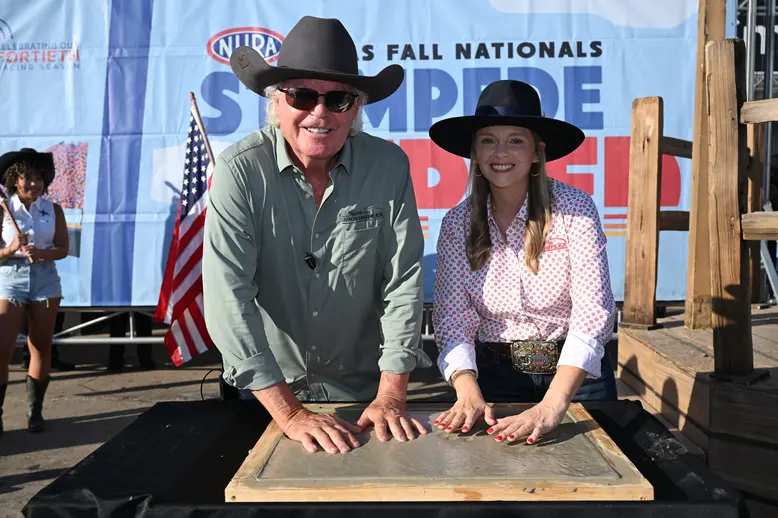 Billy Meyer and Christine Meyer Johnson imprint their hands in Motorplex concrete