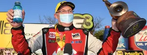 Doug Kalitta pilots his Top Fuel dragster past Steve Torrence in final