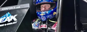 John Force spends his time between rounds on the practice tree