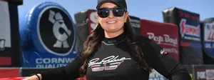 Erica Enders standing next to her car