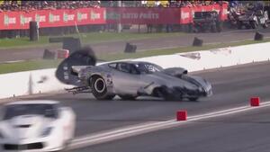 Pro Mod driver Bob Rahaim hits both guardwalls hard in Houston